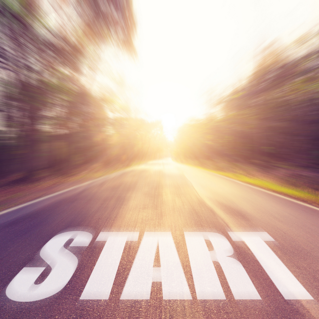 A blurred road with the word start written on the ground.